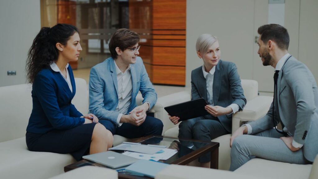 Group of professionals discussing strategy at an office.